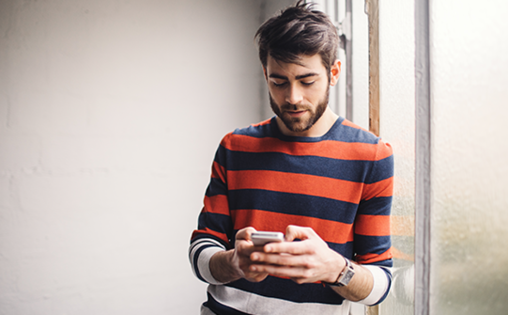 A person reading content from a smartphone