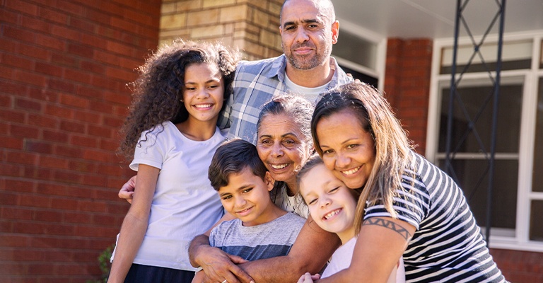 Three generations of family coming together and embracing